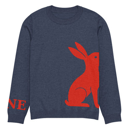 Detalle ampliado del logo rojo KÖNE y acabado del puño en tejido elástico reforzado.