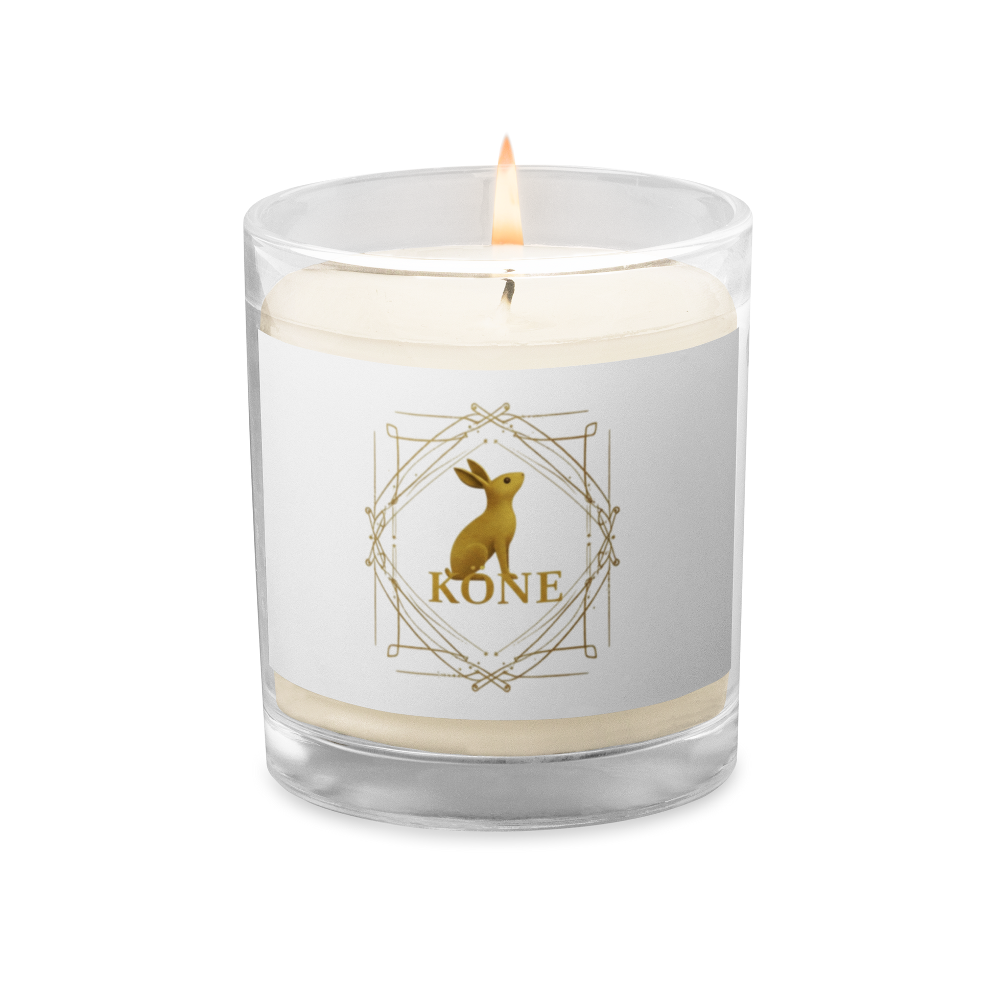 Vela de soja KÖNE blanca con logo dorado sobre fondo claro y textura suave